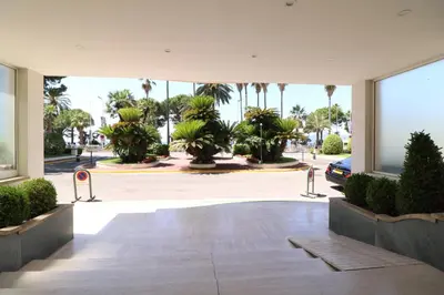 a view of a courtyard with palm trees at 1 Bedroom Henri IV on the Croisette 240 in Cannes