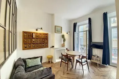 a living room with a couch and a table at Diamond Apartment in Cannes