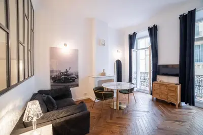 a living room with a couch and a table at Diamond Apartment in Cannes