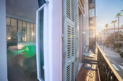 a balcony of a building with a view of a pool at Diamond Apartment in Cannes