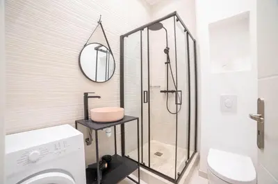 a bathroom with a shower and a toilet and a sink at Diamond Apartment in Cannes