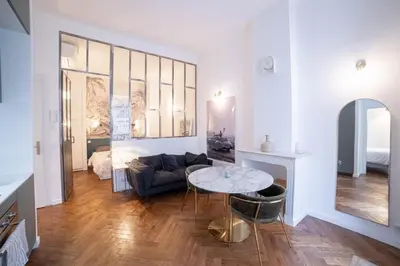 a living room with a couch and a table at Diamond Apartment in Cannes