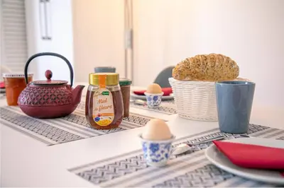 a counter with eggs and other items on a table at Les Palmiers in Cannes