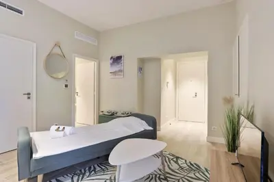 a hospital room with a bed and a table at Appartement des Anges - Welkeys in Cannes