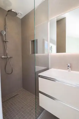 a bathroom with a shower and a sink at MEYNADIER Renovated designer apartment with rooftop in Cannes in Cannes