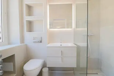 a bathroom with a toilet and a sink and a shower at NAPOLEON Luxurious renovated apartment 1min from Palais in Cannes
