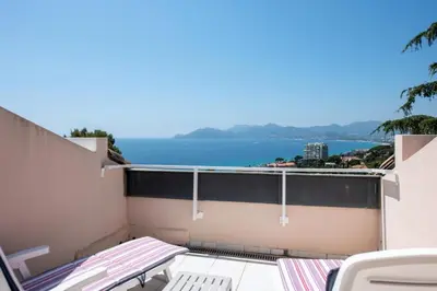 a balcony with a view of the ocean at Résidence Cannes Villa Francia - maeva Home - Appartement 2 pièces 6 personnes - Sélection MAE-2534 in Cannes