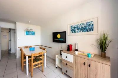 a living room with a dining room table and a desk at Résidence Cannes Villa Francia - maeva Home - Appartement 2 pièces 6 personnes - Sélection MAE-2534 in Cannes
