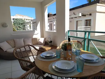 a table with plates on it on a balcony at Cannes & More in Cannes