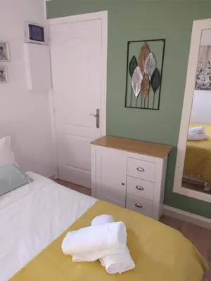 a bedroom with a bed with towels on it at Cannes & More in Cannes