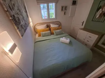 a small bedroom with a bed in a room at Cannes & More in Cannes