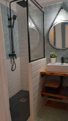 a bathroom with a sink and a mirror at Cannes & More in Cannes