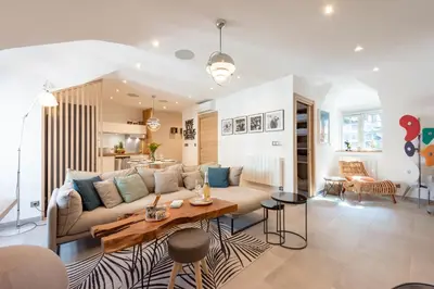 a living room with a couch and a table at Cozy 2-Br Apartment 1 min from the Beaches in Cannes