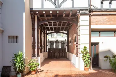 an entrance to a building with a wooden door at Cozy 2-Br Apartment 1 min from the Beaches in Cannes