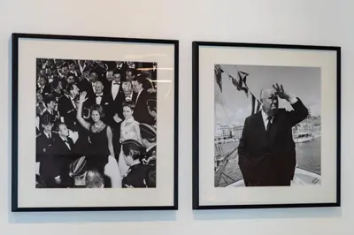 two framed photographs of a group of people at Cozy 2-Br Apartment 1 min from the Beaches in Cannes