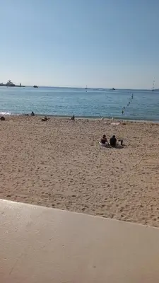a group of people laying on the beach at Villa Maupassant 06 Cannes in Cannes