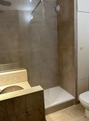a bathroom with a shower with a sink and a toilet at Studio Cannes Gray d'Albion in Cannes