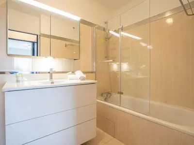 a bathroom with a sink and a shower at Apartment La Croix des Gardes by Interhome in Cannes