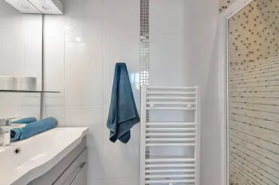 a white bathroom with a sink and a shower at CROISETTE BEACH - Modern 2 Bdrs Best Location! in Cannes