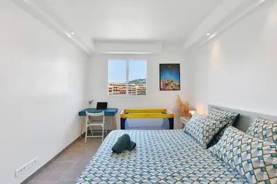 a living room with a couch and a table at CROISETTE BEACH - Modern 2 Bdrs Best Location! in Cannes