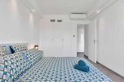 a bedroom with a bed with a blue toy on it at CROISETTE BEACH - Modern 2 Bdrs Best Location! in Cannes