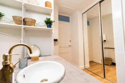 a bathroom with a sink and a mirror at Le Cannois by Coeur de Loup in Cannes