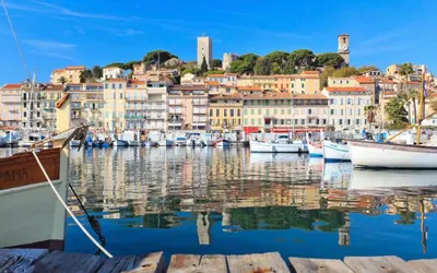 a harbor in a town with boats in the water at Le Cannois by Coeur de Loup in Cannes