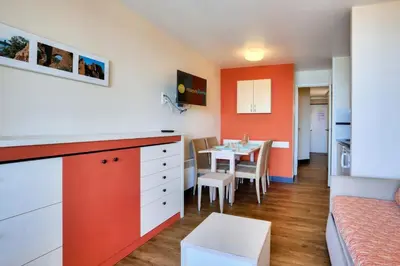 a small kitchen and dining room with a table at Résidence Cannes Villa Francia - maeva Home - Appartement 2 pièces 4 personnes - Budget MAE-8884 in Cannes