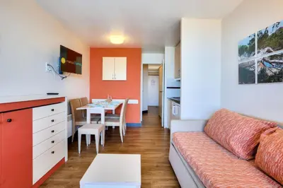 a living room with a couch and a table at Résidence Cannes Villa Francia - maeva Home - Appartement 2 pièces 4 personnes - Budget MAE-8884 in Cannes
