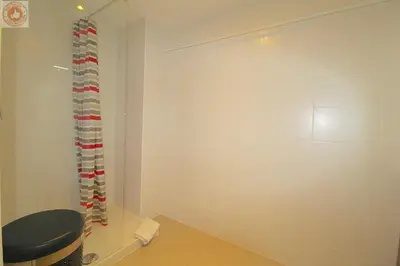 a room with a wall with red and white curtains at ALC - MONT8 - 8 min Palais and Beaches in Cannes