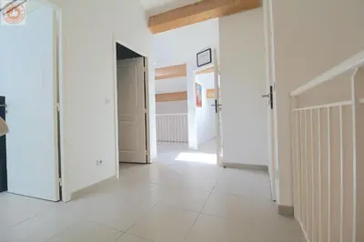 a hallway with white walls and white tile floors at ALC - MONT8 - 8 min Palais and Beaches in Cannes