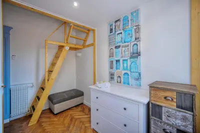 a room with a ladder and a dresser and a shelf at IMMOGROOM -Terrace with garden - Quiet - Air-conditioner in Cannes