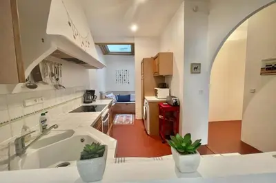 a kitchen with a sink and a tub in a room at Great studio in the heart of Cannes Meynadier old city neighbourhood ! in Cannes