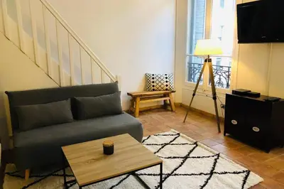 a living room with a couch and a coffee table at MIPIM Rue Montaigne, 200m Palais des festivals in Cannes