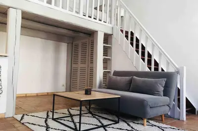 a living room with a couch and a table at MIPIM Rue Montaigne, 200m Palais des festivals in Cannes