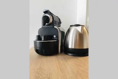 a coffee maker and a tea kettle on a wooden floor at MIPIM Rue Montaigne, 200m Palais des festivals in Cannes