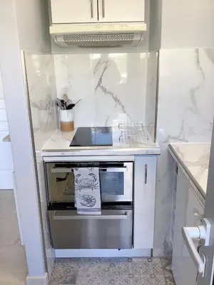 a kitchen with a stove and a sink at Studio Mimosa Croisette in Cannes