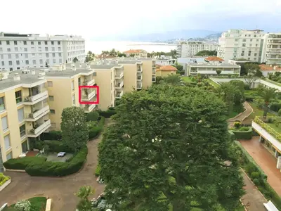 a red building in the middle of a city at Studio Mimosa Croisette in Cannes