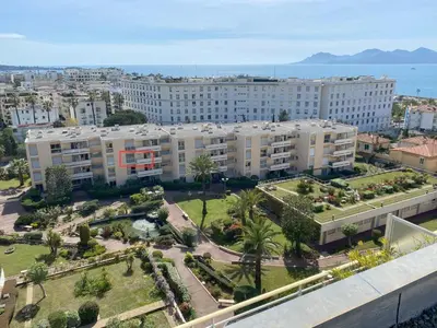 an aerial view of a city with buildings and palm trees at Studio Mimosa Croisette in Cannes