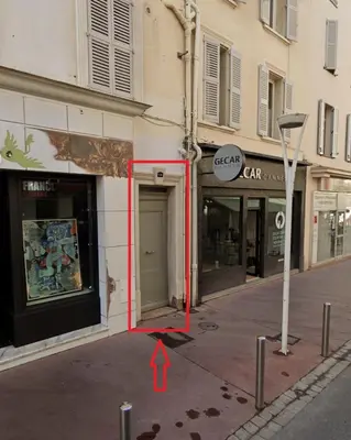 a street with a red arrow pointing into a building at Luxury Apartment 100 m to Palais des Festivals in Cannes