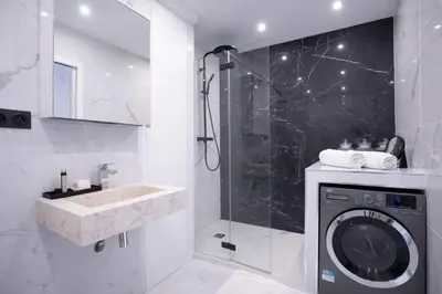 a towel on a counter with jars and a mirror at 