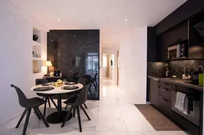 a kitchen and dining room with a table and a refrigerator at 