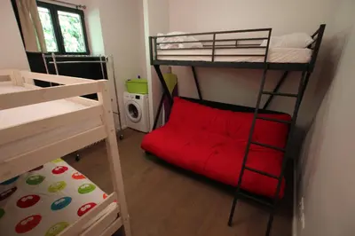 a bedroom with two bunk beds and a red pillow at SUPERBE MAISON DE VILLE in Cannes