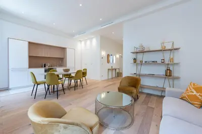 a living room with a couch and chairs and a table at Luxury Apartment - Heart of Cannes - Rue d'Antibes in Cannes