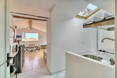 a kitchen with a sink and a counter top at IMMOGROOM - cosy - Forville market - sea view in Cannes