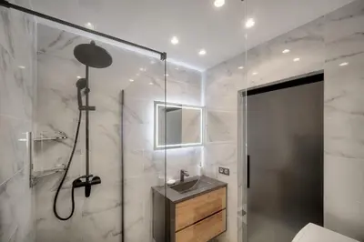 a bathroom with a shower and a sink at Cannes Luxury Rental - Stunning apartment with terrace to rent Grand Hotel in Cannes