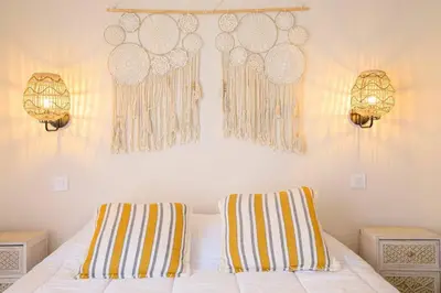 a bedroom with two lamps and a bed with two pillows at Le Bain De Soleil - Le Bain De Soleil 5 star Two bedroom apartment in Cannes