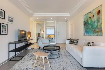 a living room with a couch and a table at REF 1426 - Cannes Croisette - Sea view apartment for rent in Cannes