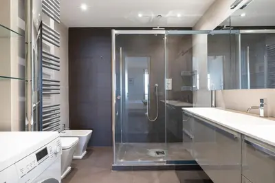 a bathroom with a glass shower and a toilet at REF 1426 - Cannes Croisette - Sea view apartment for rent in Cannes