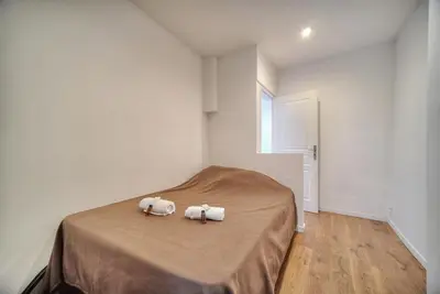 two towels on a bed in a white room at Charmant 2 pièces MEYNADIER-FORVILLE A1B209 in Cannes